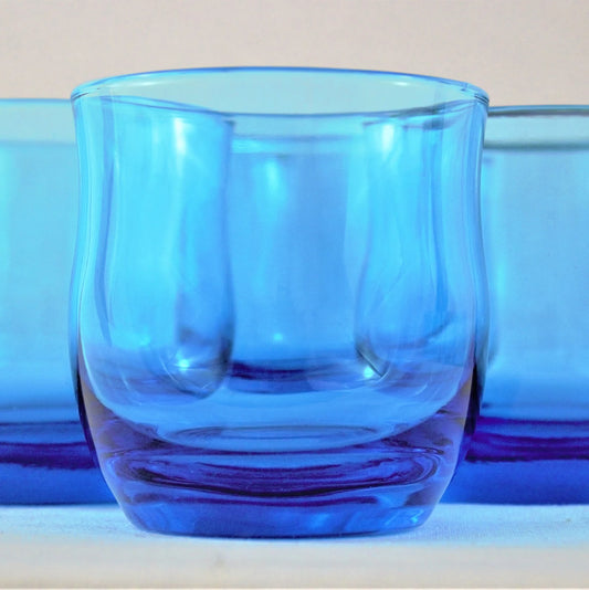 Blue glass tumbler on a light background
