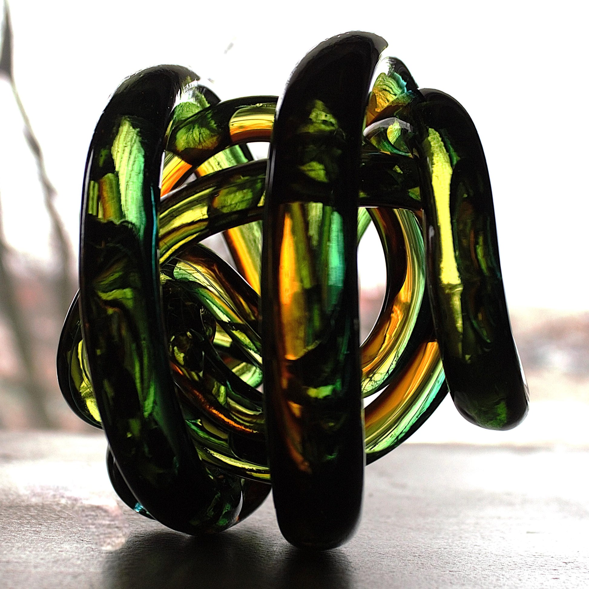 Multicolor Twisted Glass Knot: Intertwining Art Glass Sculpture