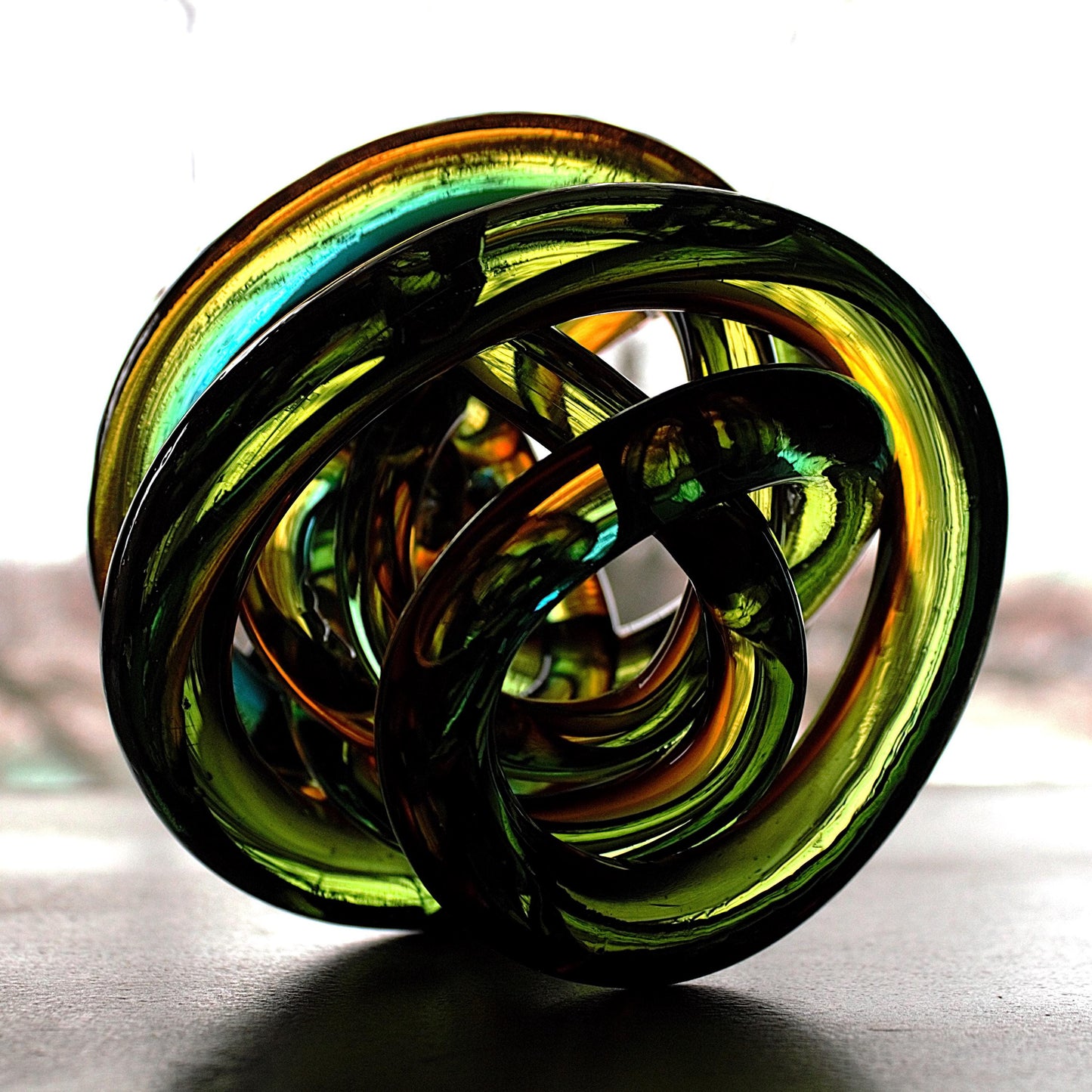 Multicolor Twisted Glass Knot: Intertwining Art Glass Sculpture