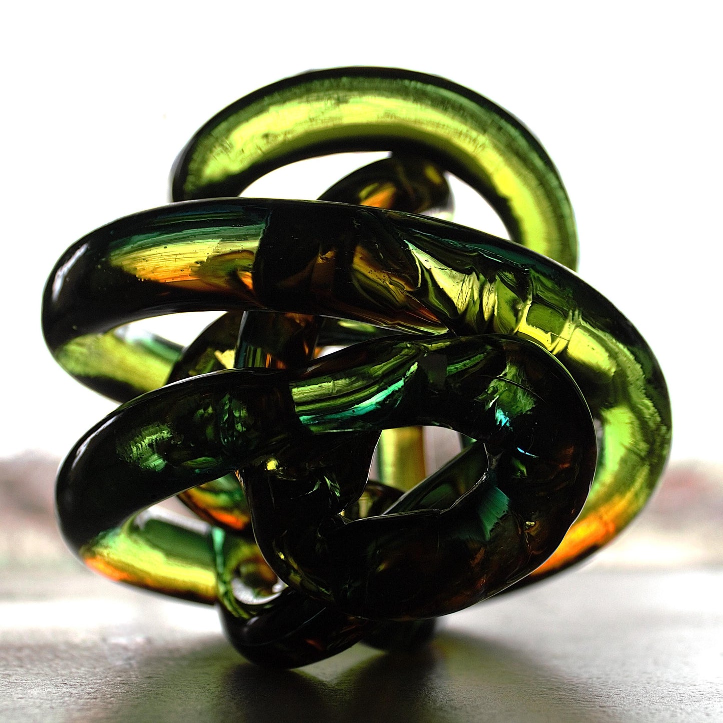 Multicolor Twisted Glass Knot: Intertwining Art Glass Sculpture
